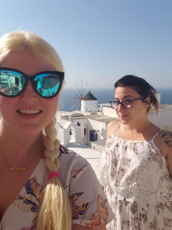 Millennial Cruisers Tracy Cahill and Natlie Kolodij in Oia Santoini Greece